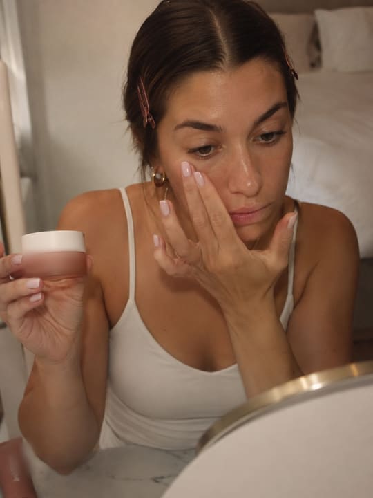 Creators applying makeup and skincare at home